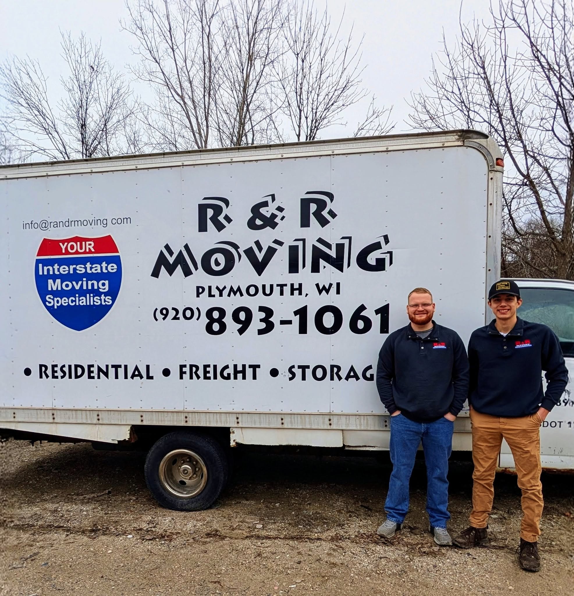 R&R Moving crew in front of the company truck